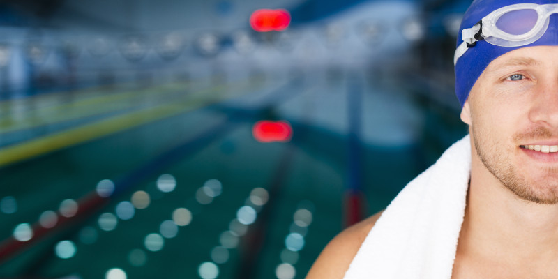 smiley male swimmer pool